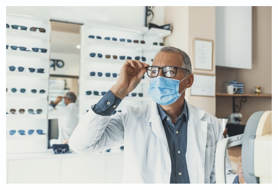 Man wearing glasses and a white robe