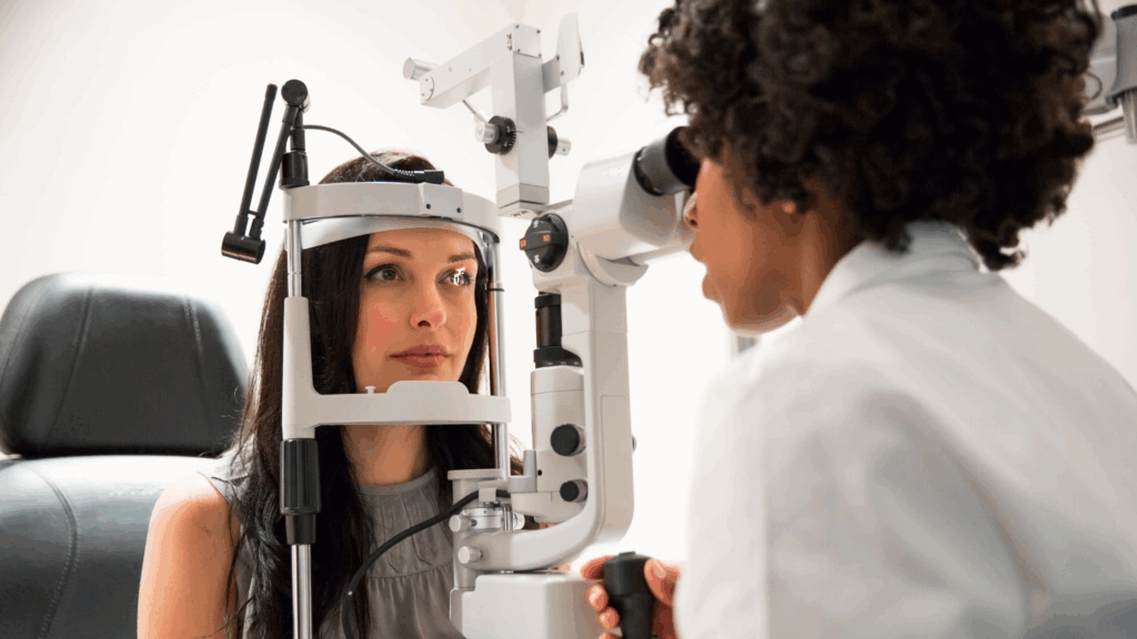 doctor performing an eye exam on a lady